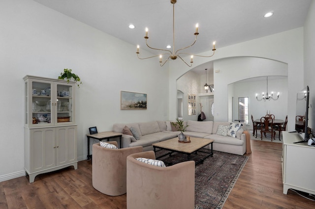 living room featuring dark hardwood / wood-style flooring and a notable chandelier