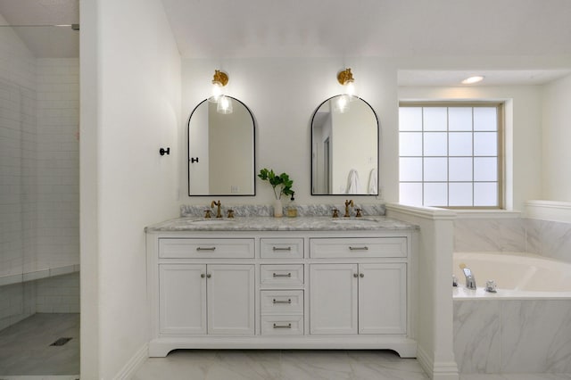 bathroom featuring separate shower and tub and vanity