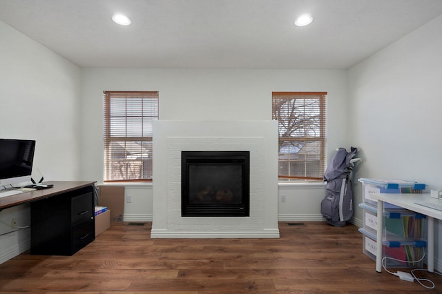 office with dark wood-type flooring