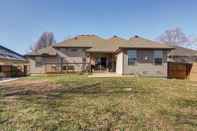 back of property featuring a deck, a yard, and a patio