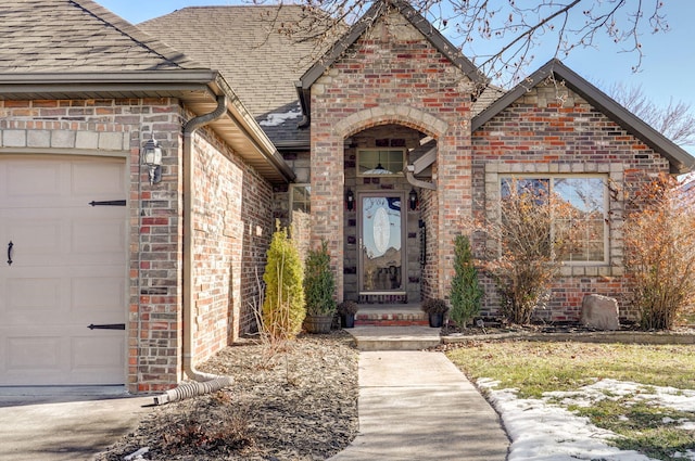 entrance to property featuring a garage