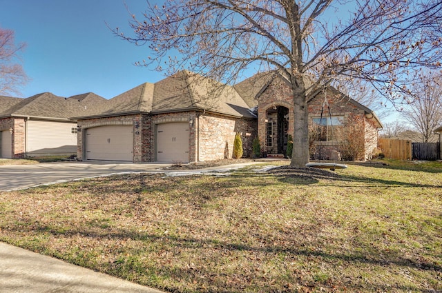 view of front facade with a front yard and a garage