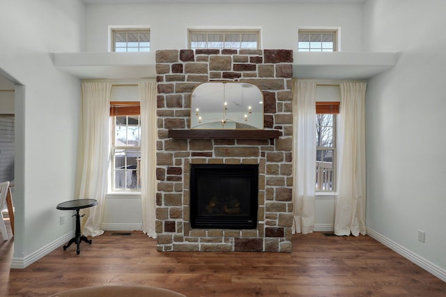 living room with a fireplace and dark hardwood / wood-style floors