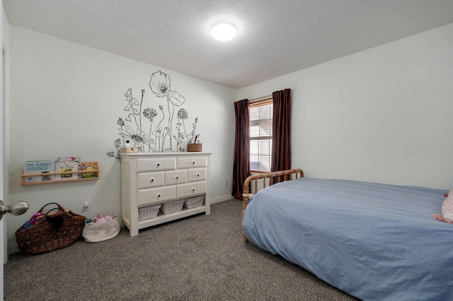 bedroom with a textured ceiling and carpet