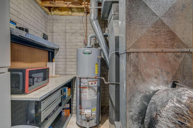 utility room featuring heating unit and water heater