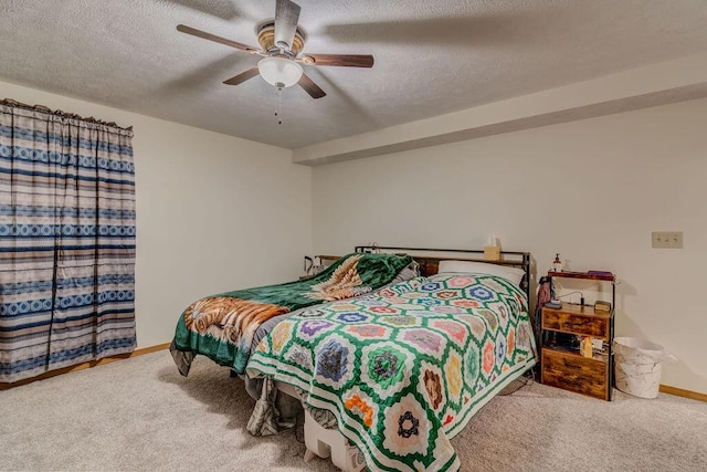 carpeted bedroom with a textured ceiling and ceiling fan