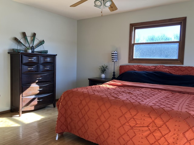 bedroom featuring ceiling fan and wood-type flooring