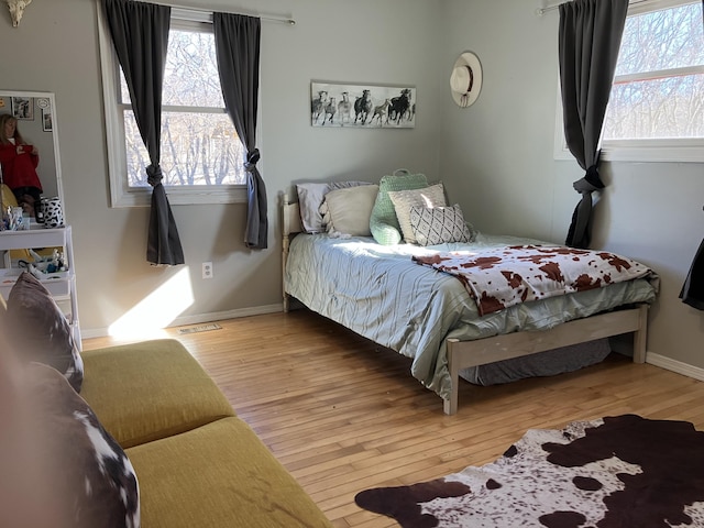 bedroom with hardwood / wood-style flooring