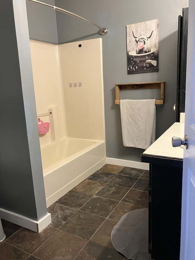 bathroom with tub / shower combination and vanity