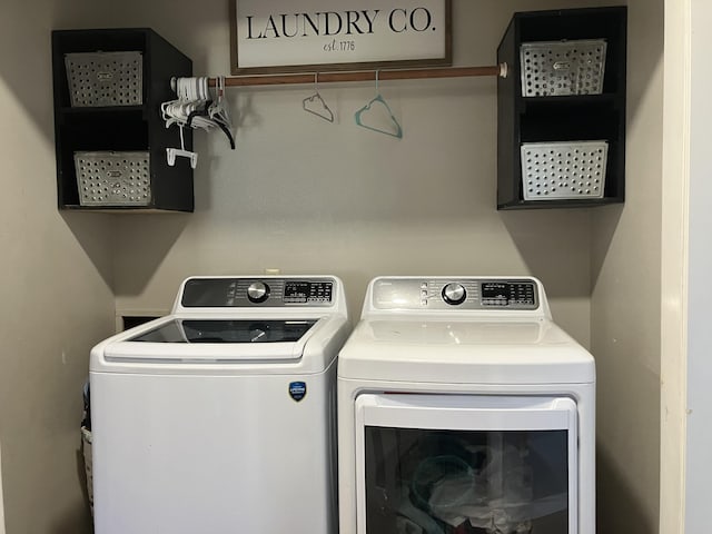 washroom featuring washer and dryer