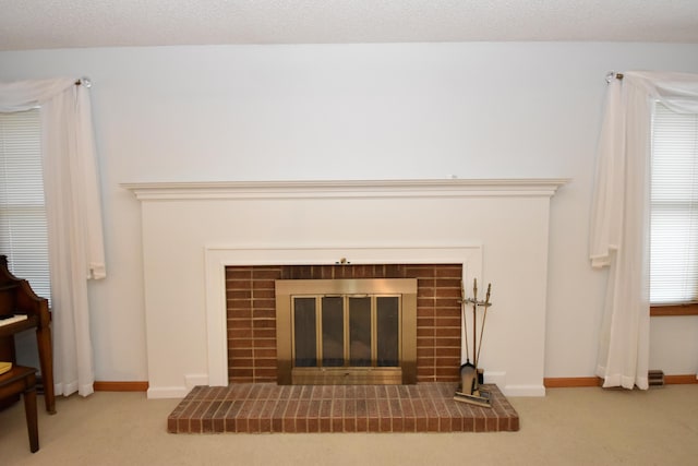 details with baseboards, carpet flooring, and a tile fireplace