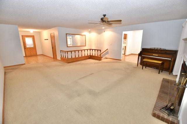 interior space featuring a textured ceiling and ceiling fan