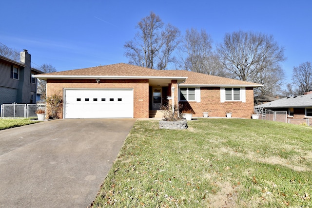 ranch-style house with brick siding, an attached garage, a front yard, fence, and driveway