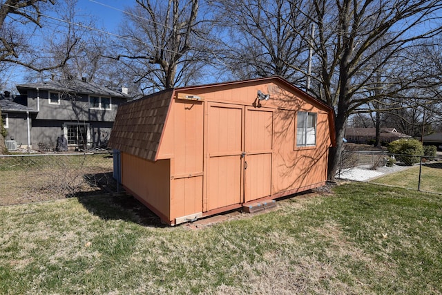 view of shed featuring a fenced backyard