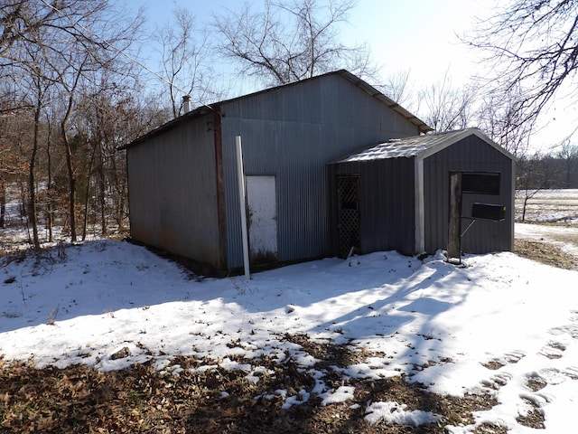 view of snow covered garage