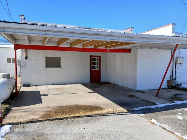 entrance to property with a carport