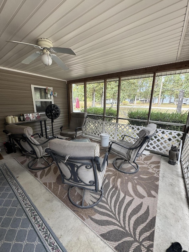 sunroom featuring ceiling fan