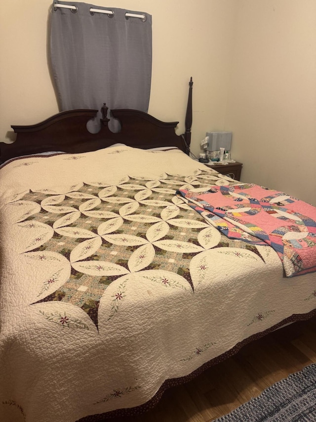 bedroom featuring wood-type flooring