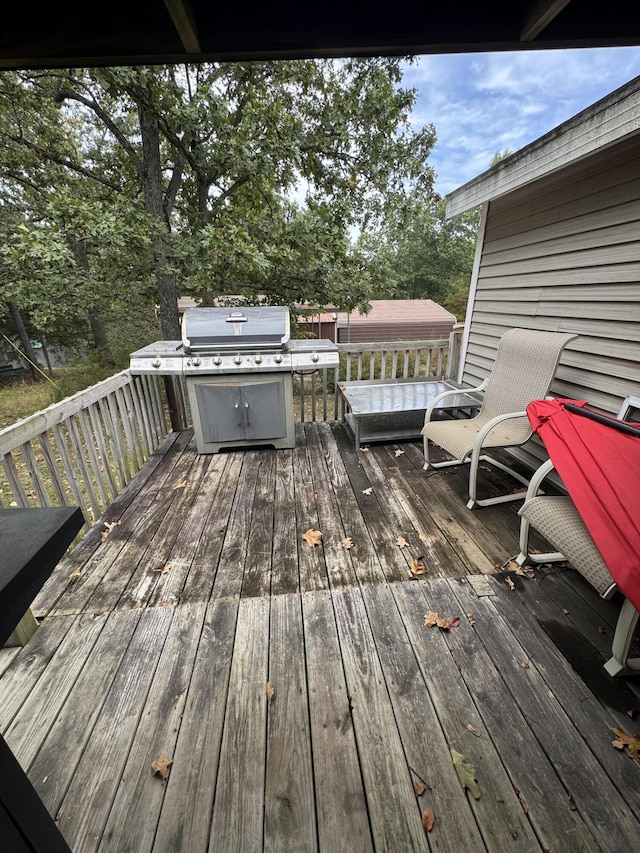 wooden deck with grilling area