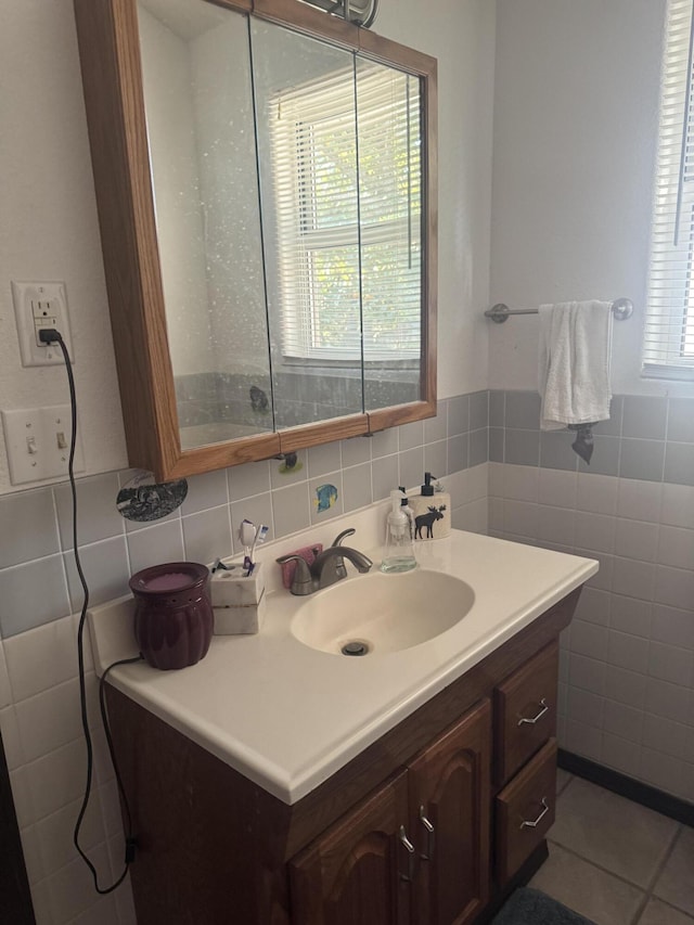 bathroom with tile walls, tile patterned floors, and vanity