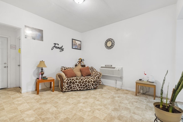 sitting room featuring a wall mounted air conditioner