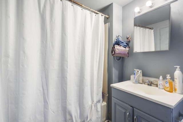 bathroom with vanity and shower / bathtub combination with curtain