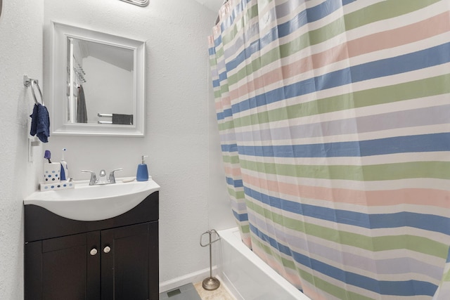 bathroom featuring shower / bath combination with curtain and vanity