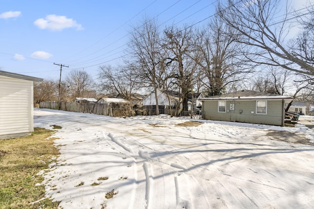 view of yard layered in snow