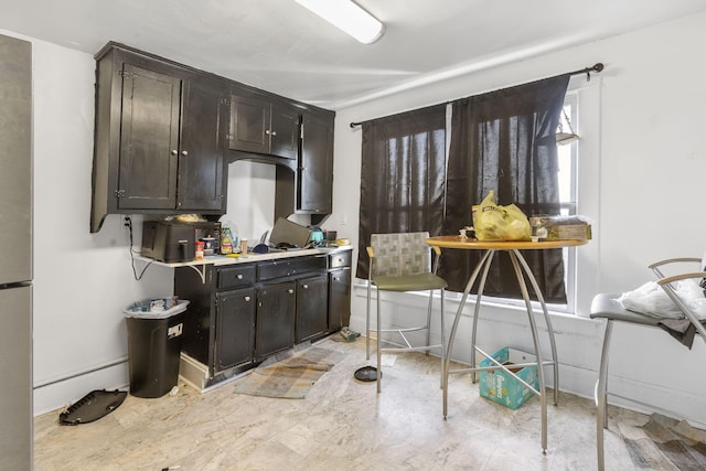 kitchen with dark brown cabinetry