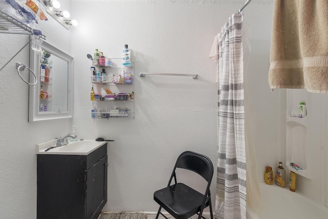 bathroom with shower / bath combo and vanity