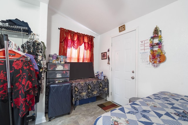 bedroom with lofted ceiling