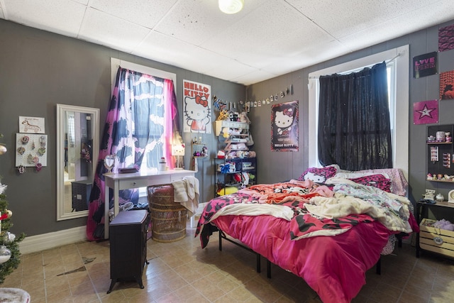 bedroom featuring a paneled ceiling