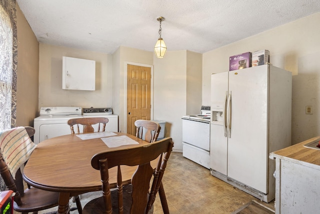 dining space featuring a textured ceiling and washer / clothes dryer