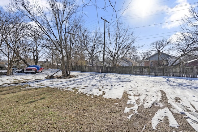 view of yard covered in snow