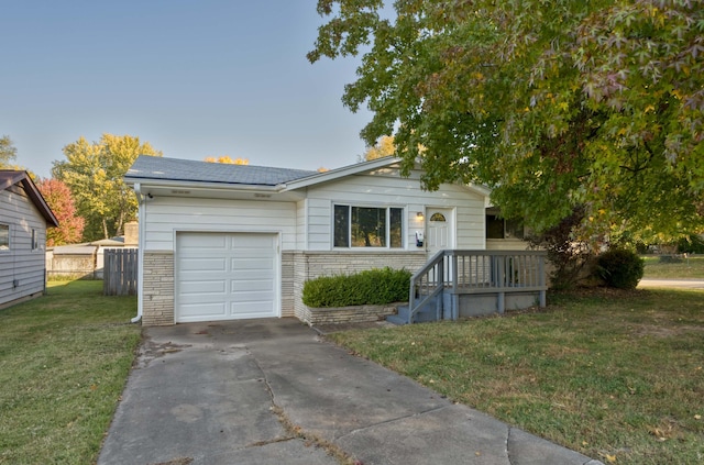 ranch-style home with a garage and a front yard