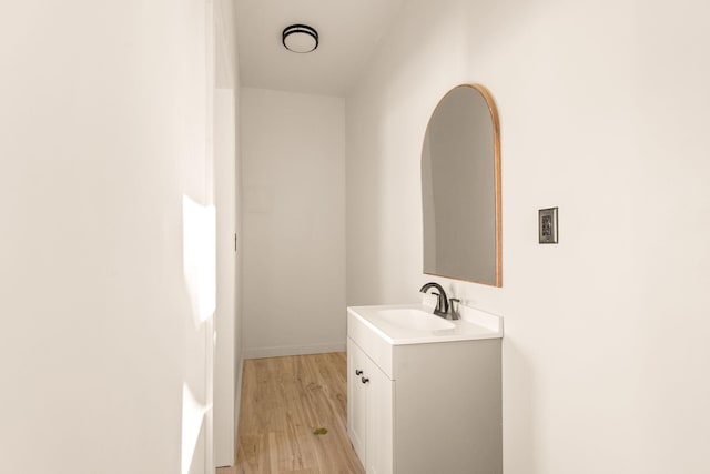 bathroom featuring hardwood / wood-style floors and vanity