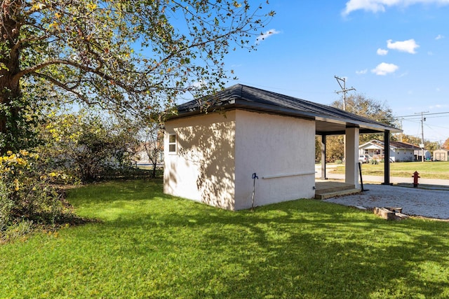 view of side of home featuring a lawn