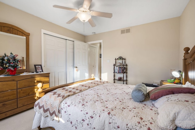 bedroom with ceiling fan, a closet, and carpet floors