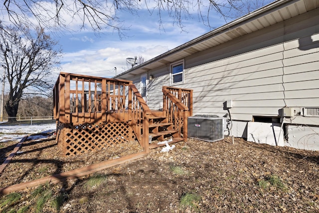 exterior space with a deck and central AC