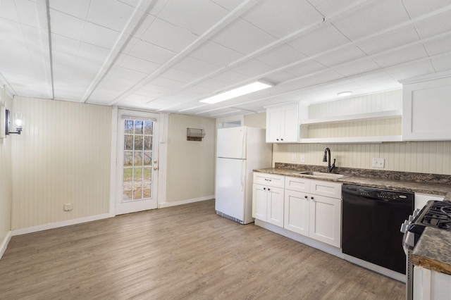 kitchen with sink, black dishwasher, white cabinetry, light wood-type flooring, and white refrigerator