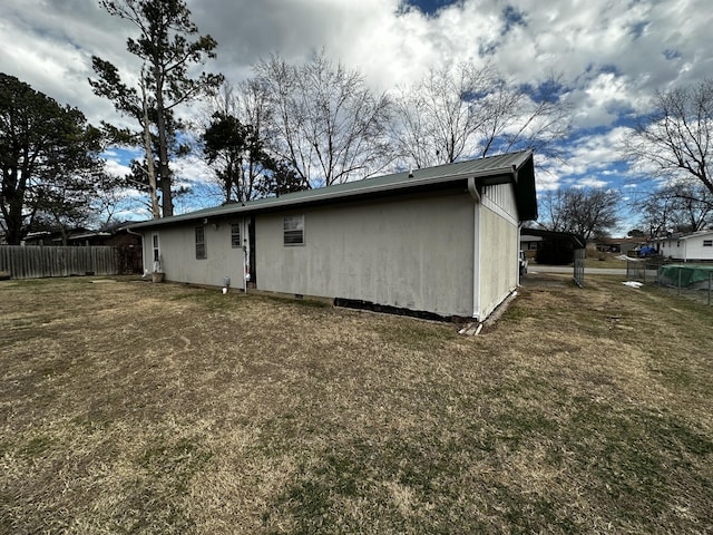 view of property exterior with a lawn