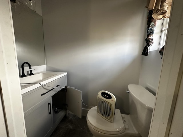 bathroom with toilet and vanity