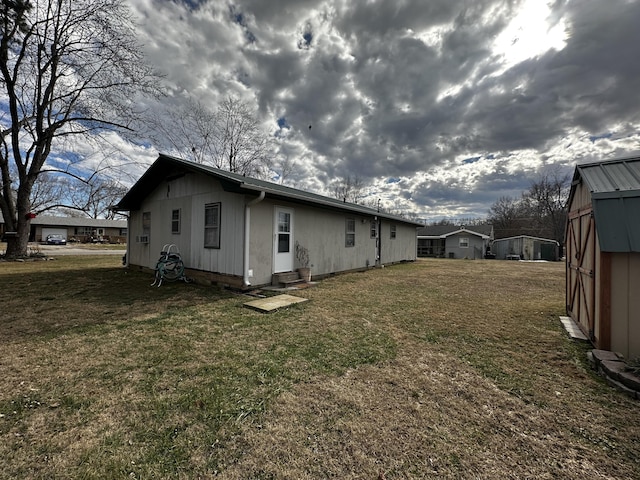 view of side of home featuring a lawn