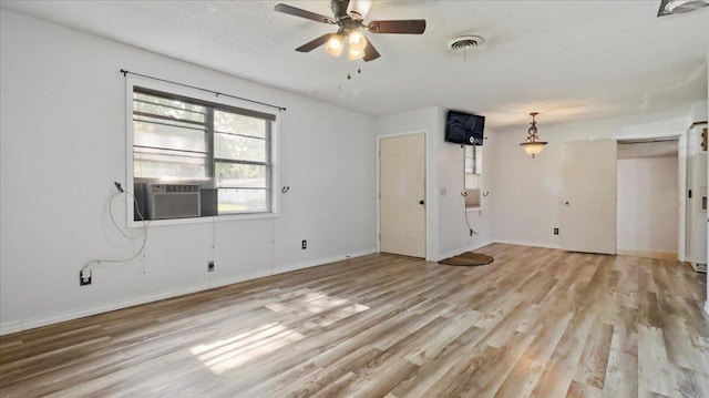 1933 Lynn Dr, West Plains, MO 65775 - spare room with light wood finished floors, cooling unit, a ceiling fan, and baseboards