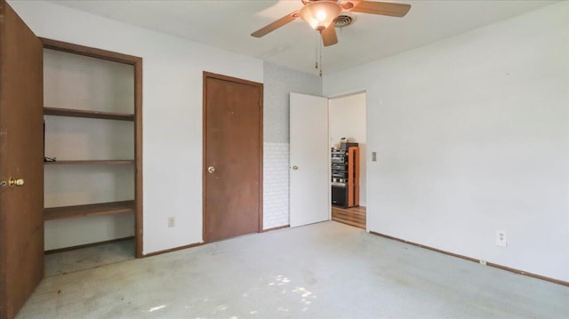 1933 Lynn Dr, West Plains, MO 65775 - unfurnished bedroom with carpet, ceiling fan, and two closets