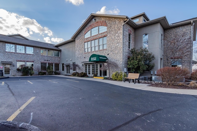 158 Troon Dr Unit 20, Branson, MO 65616 - view of property featuring uncovered parking and cooling unit