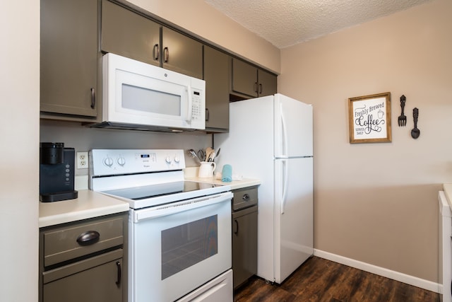 158 Troon Dr Unit 20, Branson, MO 65616 - kitchen featuring white appliances, dark wood finished floors, a textured ceiling, baseboards, and light countertops
