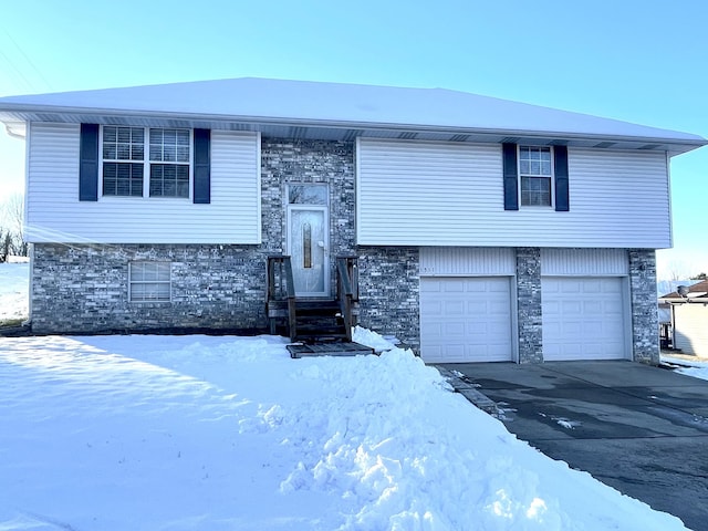 bi-level home featuring a garage