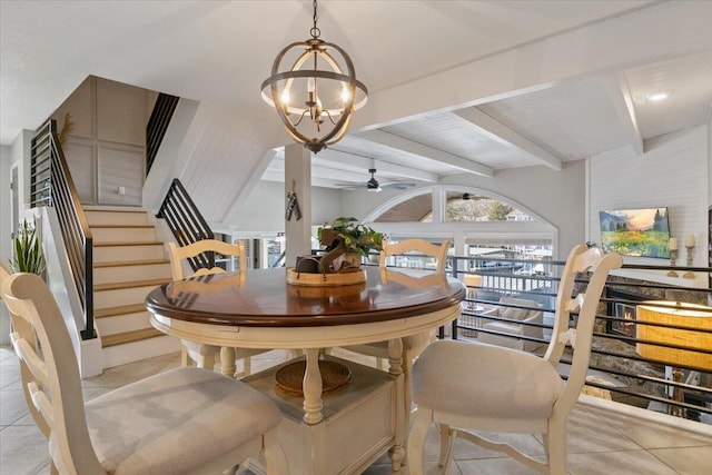 dining area with light tile patterned floors, beamed ceiling, and ceiling fan with notable chandelier