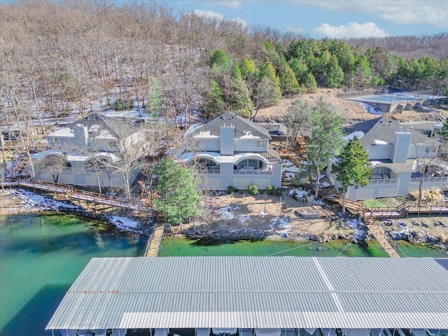 birds eye view of property with a water view